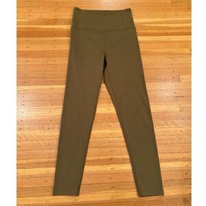 Girlfriend Collective green high rise leggings.